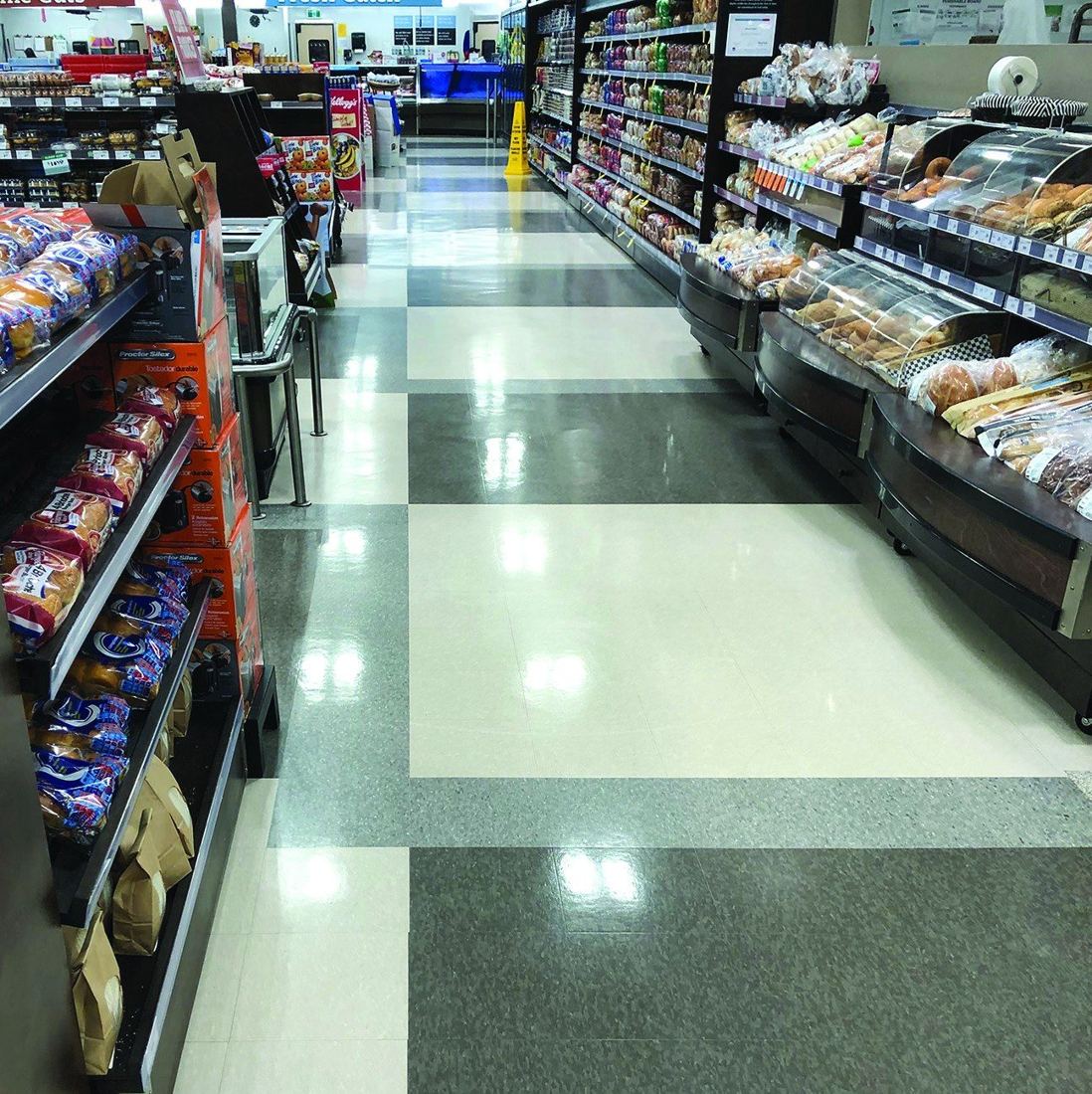 Bright, glossy VCT floor in a Sobeys grocery store aisle in Halifax, Nova Scotia, maintained with SIMIX