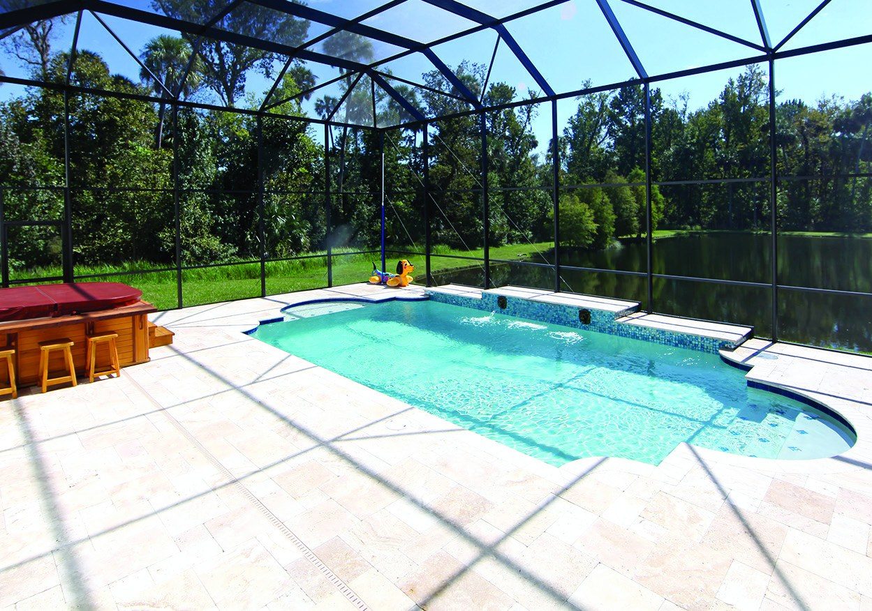 Screened pool deck with light pavers coated with SIMIX Ceramic Clearcoat