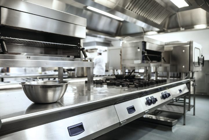 Commercial kitchen where SIMIX Peroxide Cleaner, used on its own, replaces routine grease-trap hydrojetting